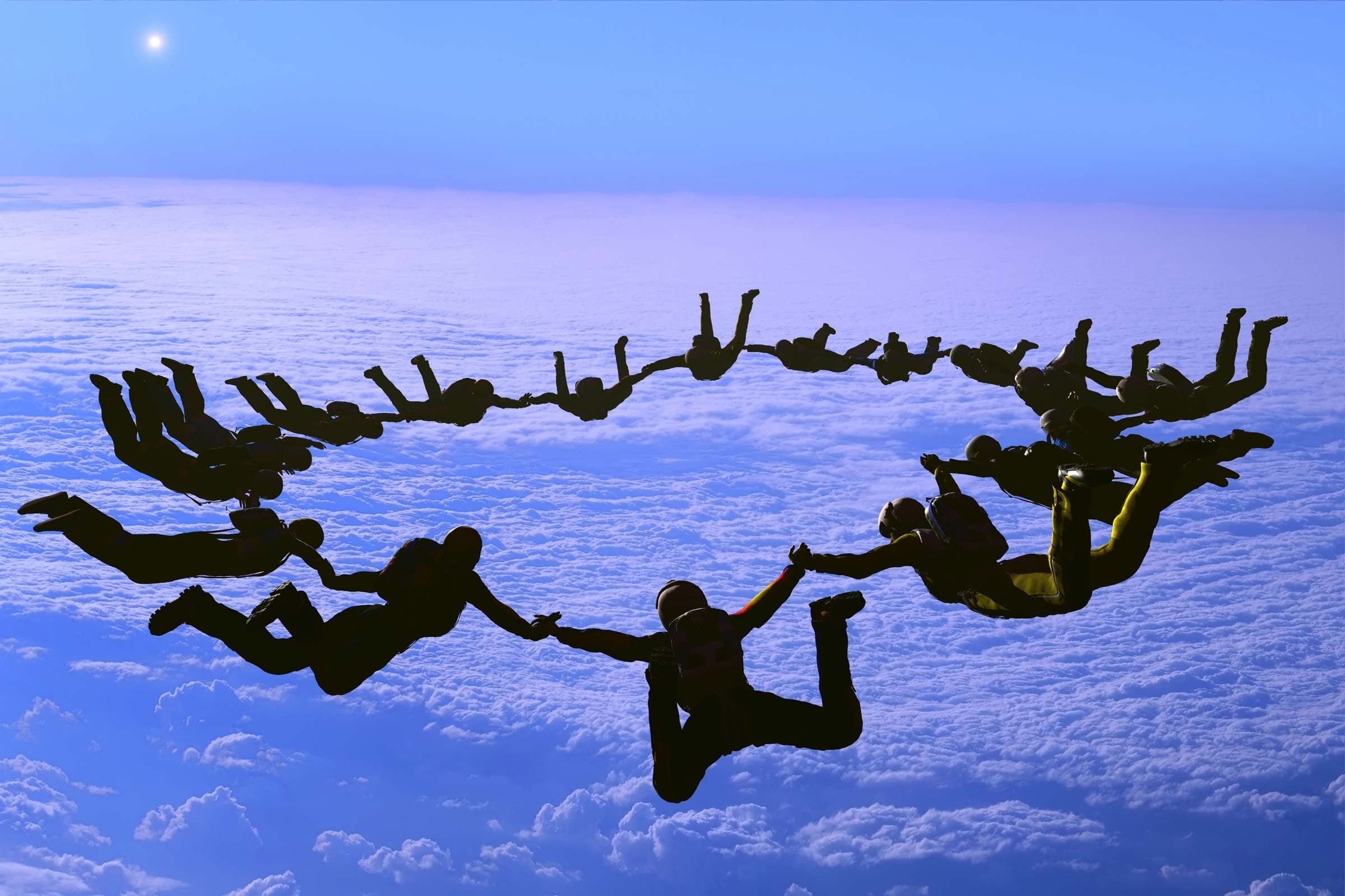 Skydivers working together as a team